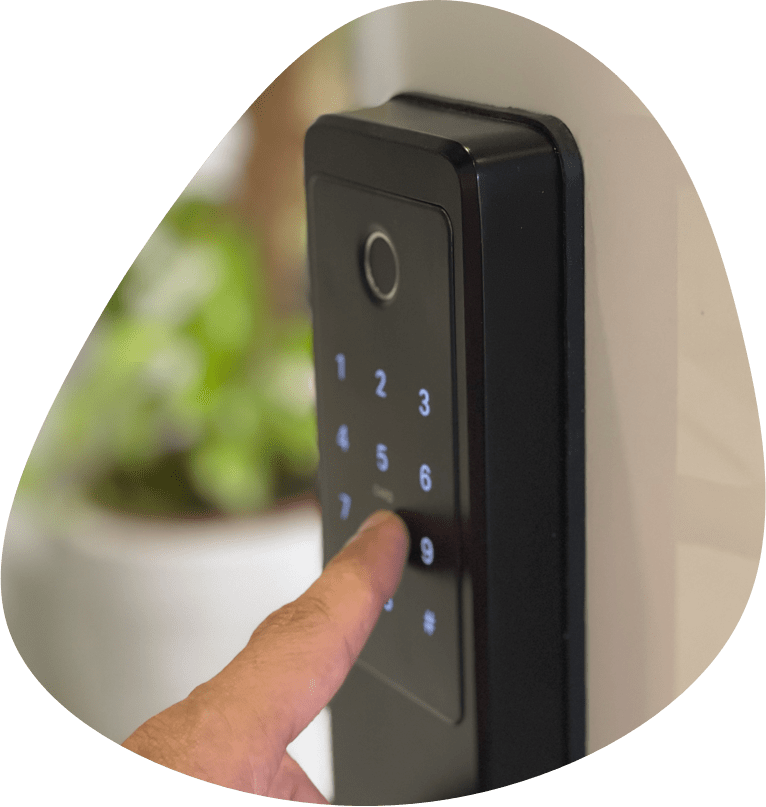 Hand entering a personal code on the smart lock keypad